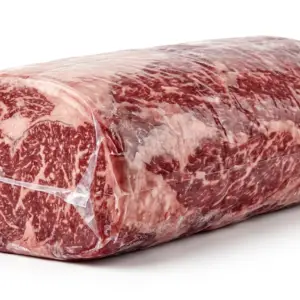 Vacuum-packed frozen beef cube roll showing high marbling for wholesale export
